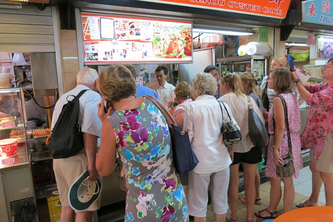 Singapore Chinatown Private Food Tour - Chinatown street market walk: vegetables, snacks, and fast local rhythms