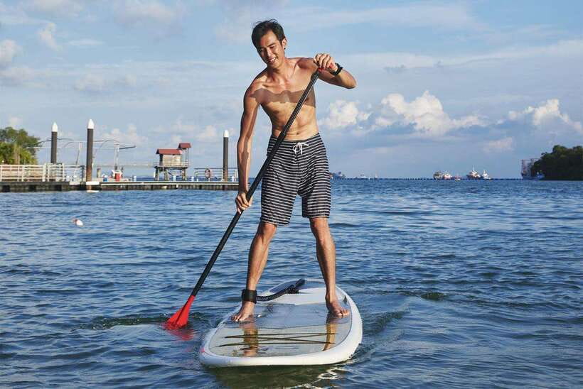 Singapore: Stand up Paddle board - Ola Beach Club Ticket - Glide over the water and enjoy the Sentisa island coastline